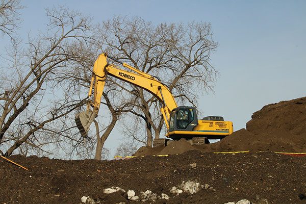 Excavator digs a foundation