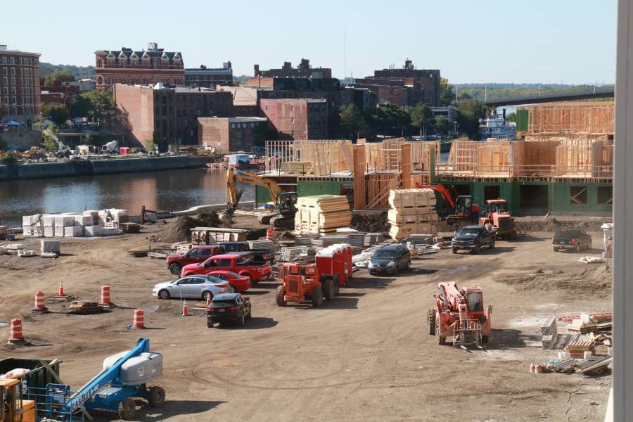 The construction site of Starbuck Island Building #30 with trucks and construction workers