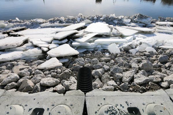 Redi Rock blocks in place with ice along the rivers edge